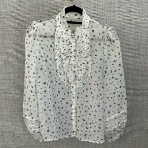 Sheer blouse with ruffle and lace detail and covered buttons